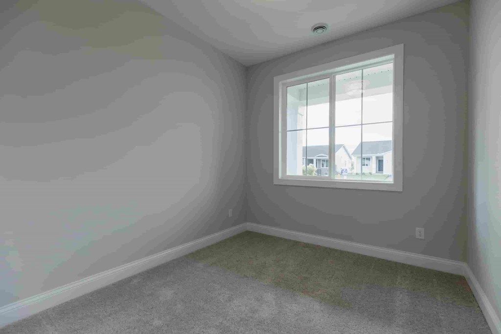 an empty room with a window in it