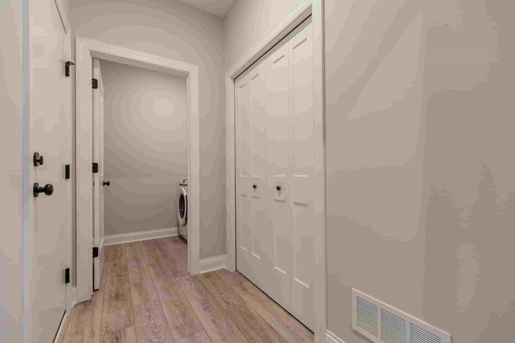 a bedroom with two closets and a door to a bathroom