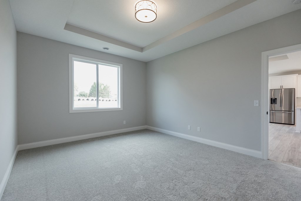 an empty living room with a large window