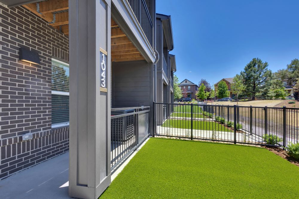 Private fenced front yard of townhome