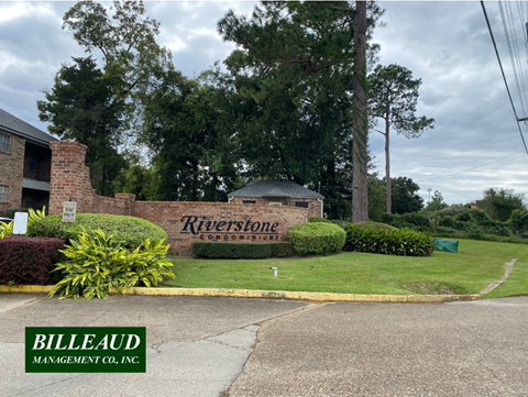 a street sign in front of a brick building