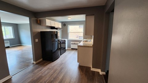 a view of a kitchen from the living room