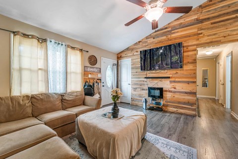 a living room with a couch and a fireplace