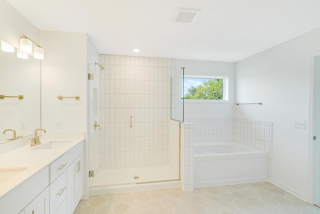 a white bathroom with a shower and a tub