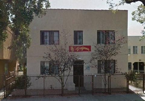 a white building with a sign on the side of it