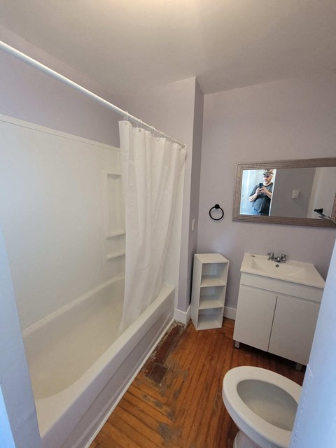 a small bathroom with a toilet sink and shower