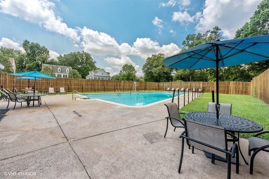 Outdoor Pool with Lounges and Tables