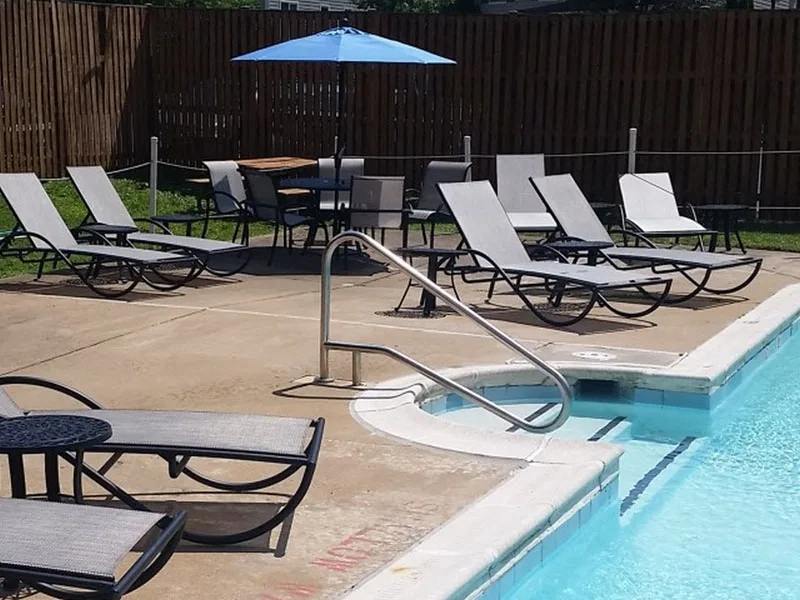 Outdoor Pool with Lounges and Tables