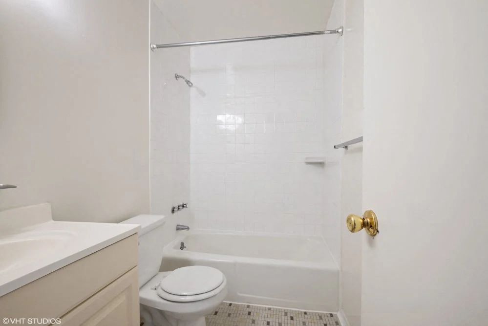 Bright white bathroom with full tub
