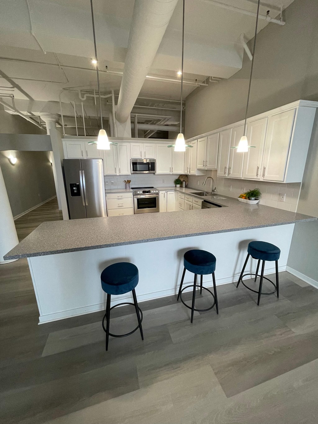 a kitchen with a counter top and stools
