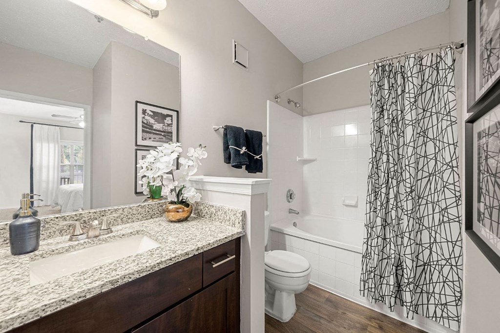 an open bathroom with a sink and a toilet
