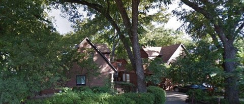 a house with trees in front of it