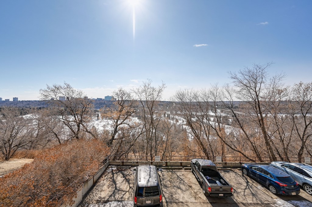 the view of a parking lot with cars parked