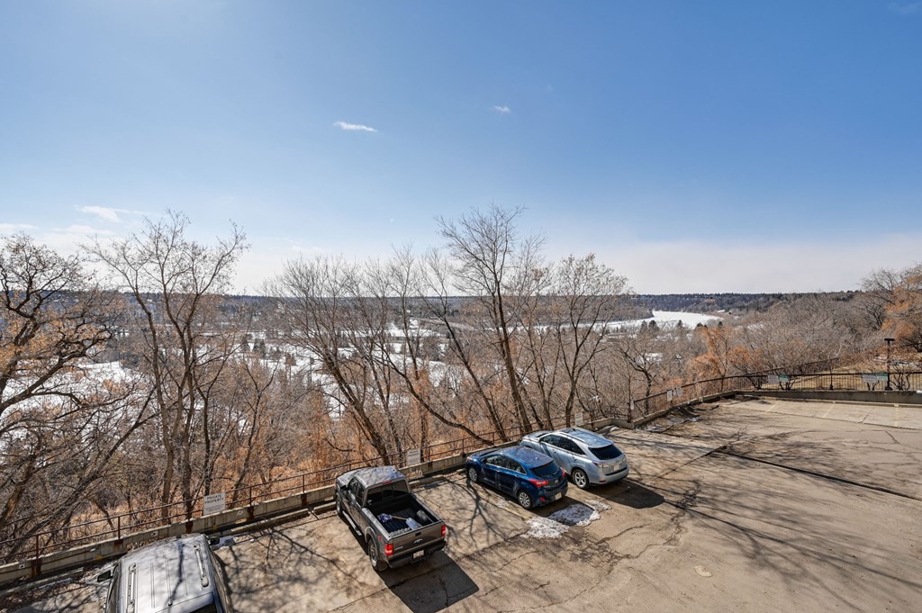 an aerial view of cars parked in a parking lot