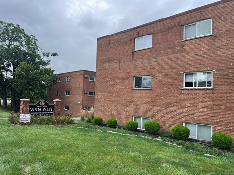 A brick building with a sign that says Vista West.