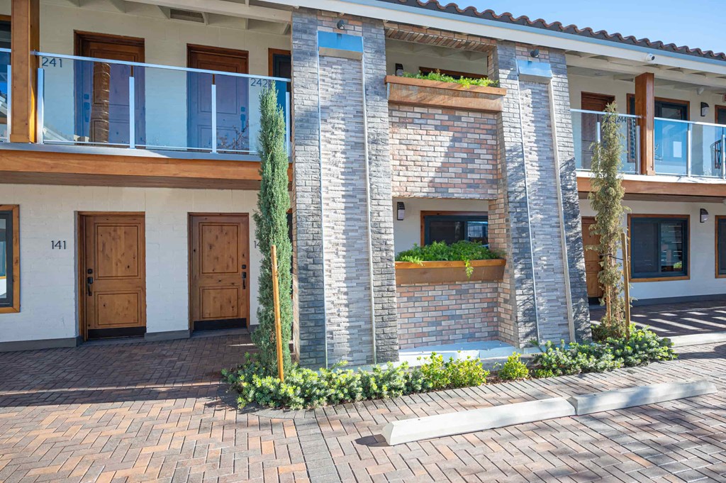 a building with a brick facade and a courtyard