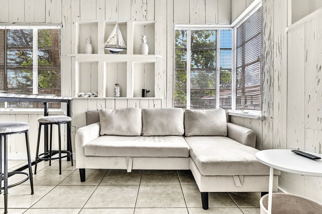 a living room with a couch and a table