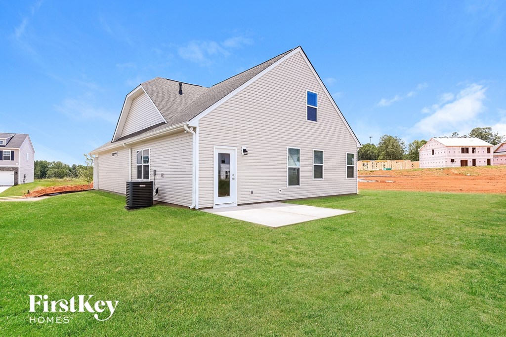 A house with a lawn in front of it.