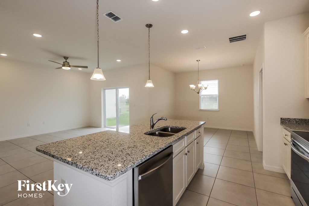 a kitchen with granite counter tops and a sink