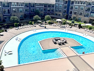 an aerial view of a swimming pool at an apartment building