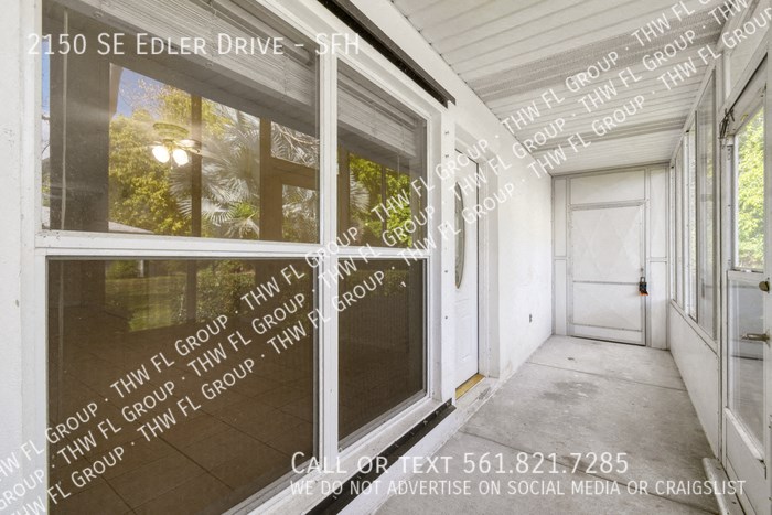 a view of the front door of a house with words etched on the glass