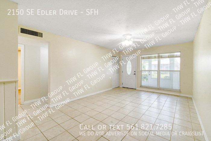 an empty living room with words on the wall