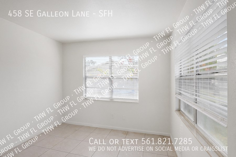 a view of a room with windows and a wall with words on it