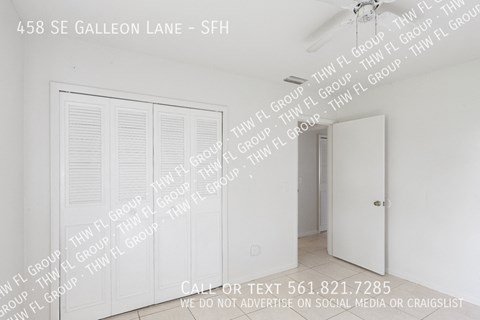 a bedroom with a closet and a door and words on the wall