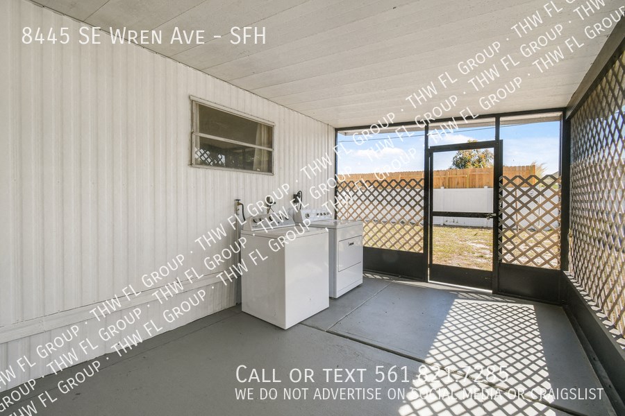 a kitchen with a sink and a door to a patio