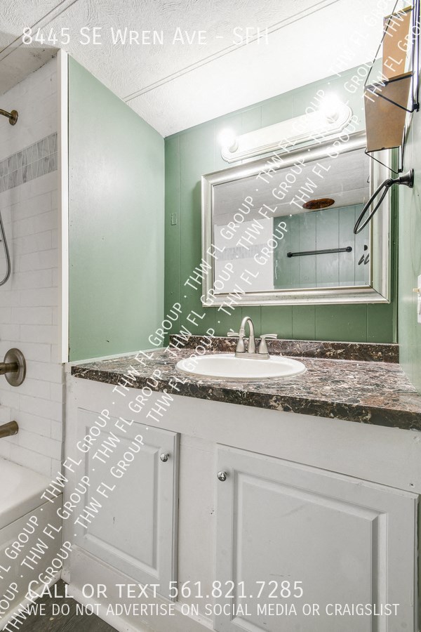 a small bathroom with a sink and a mirror