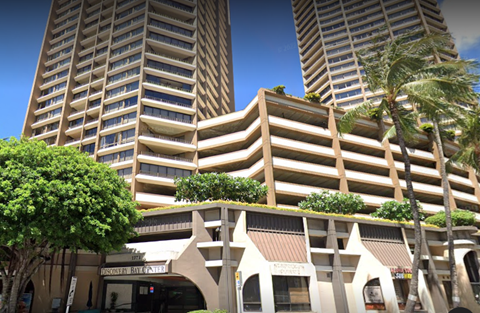 A tall building with a sign that says "Marriott Renaissance".