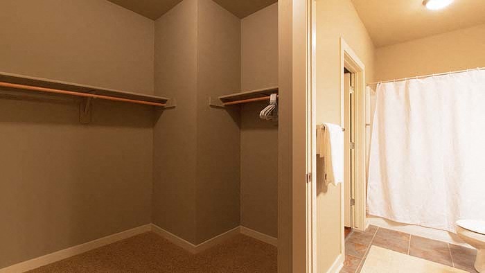 a bathroom with a shower and a toilet in it