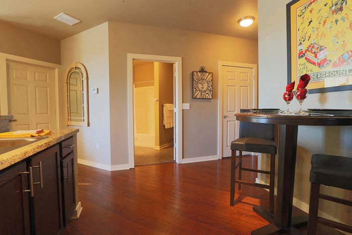 a kitchen and dining room with a table and chairs