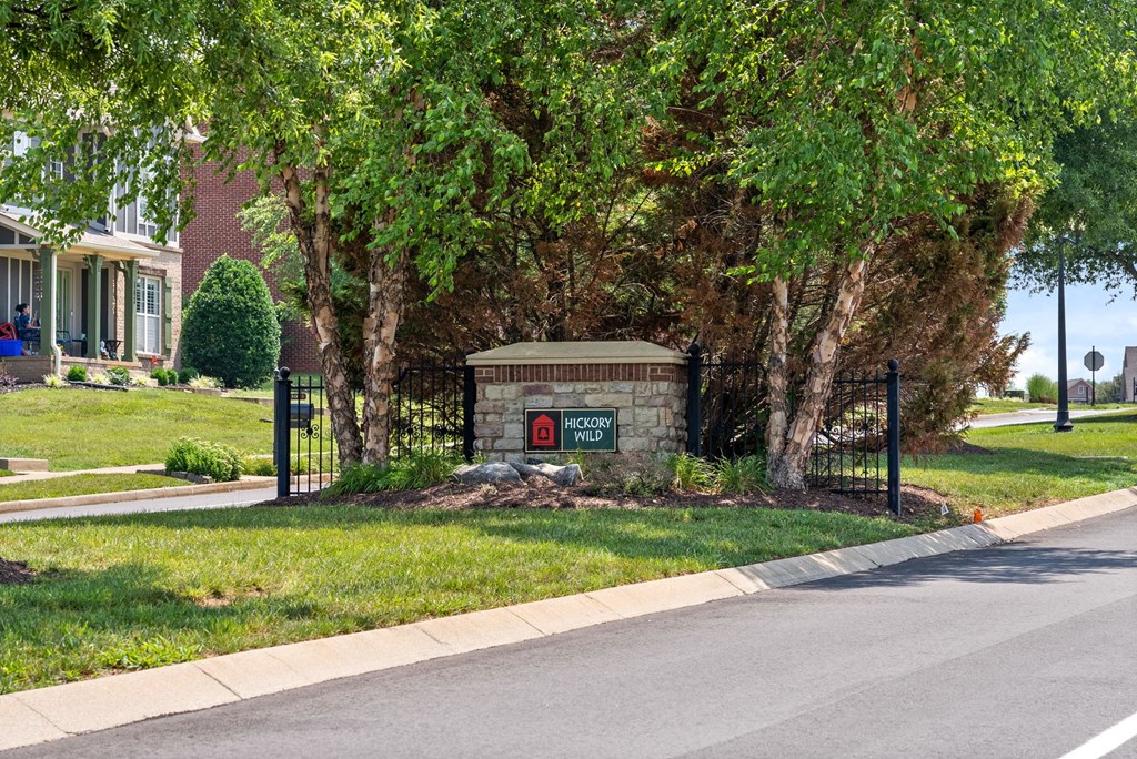 a building with a sign on the side of a street