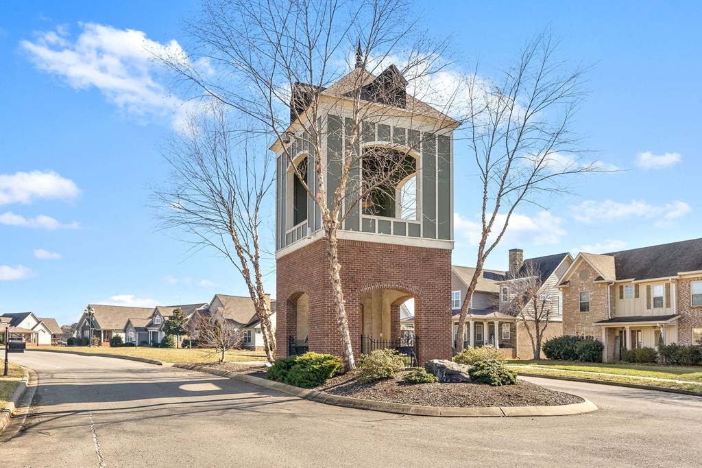 the bell tower on the corner of a street