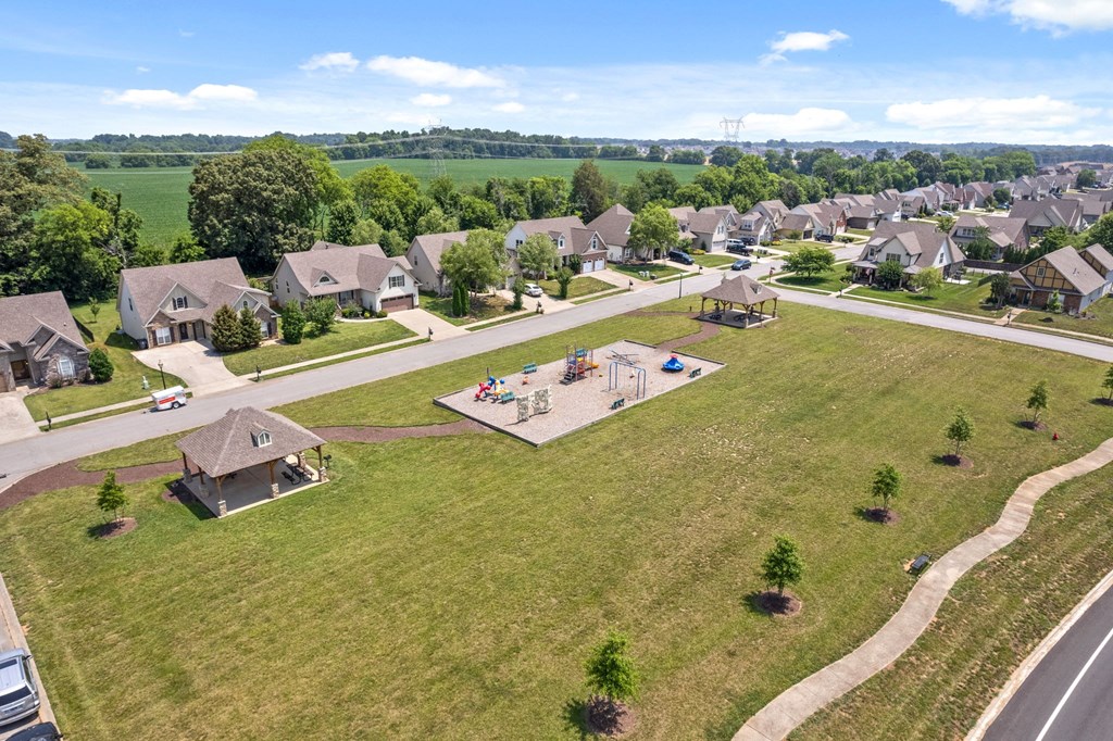 an aerial view of a neighborhood with houses and a playground