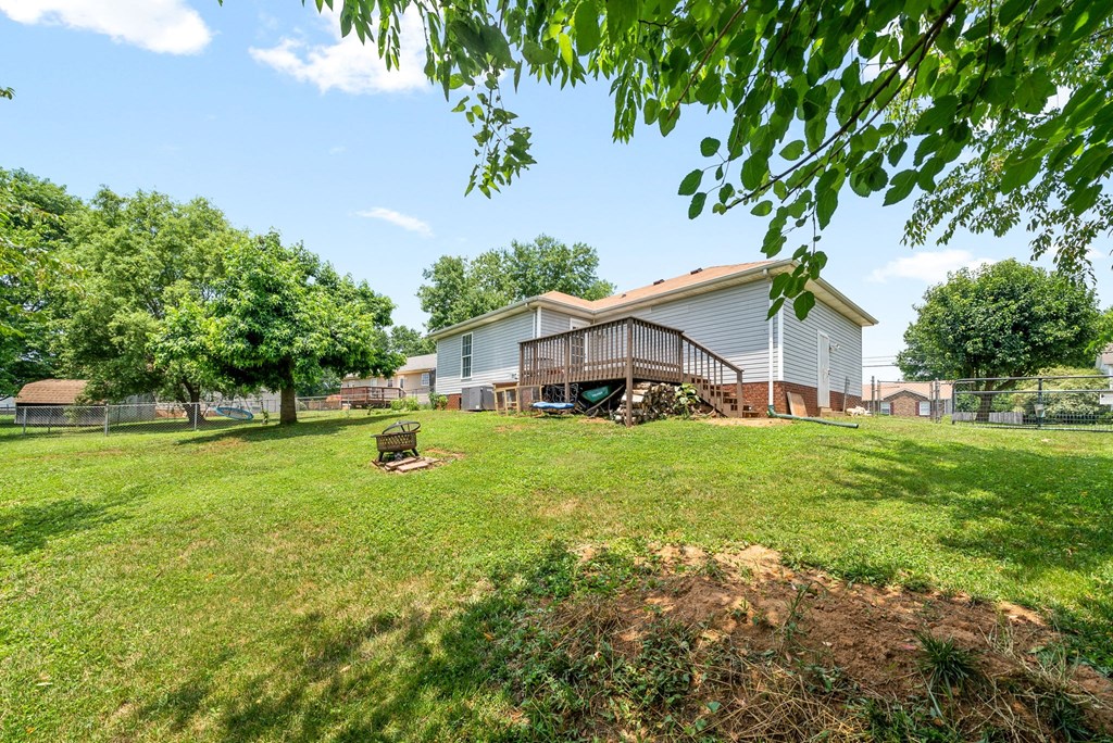 the view of a house with a yard in front of it