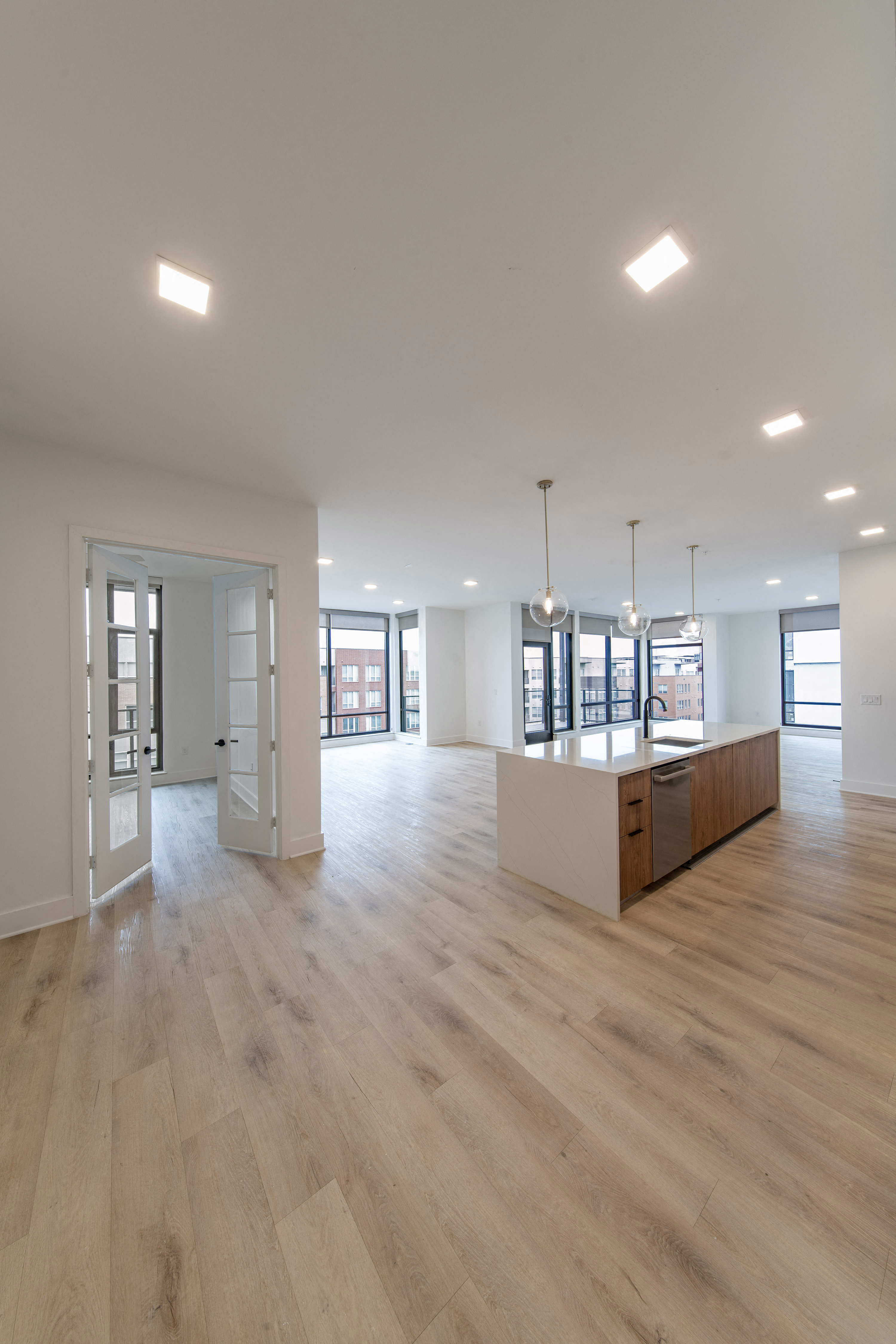a large living room and kitchen in a new home