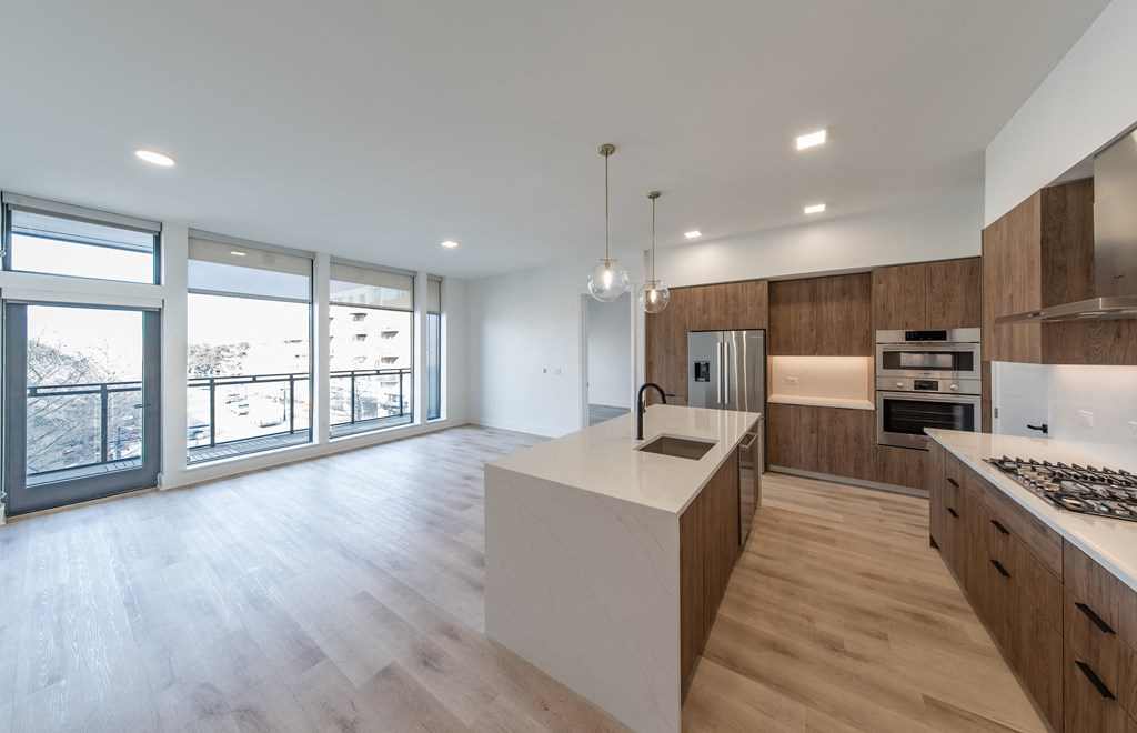 a large kitchen with a large island in the middle of it