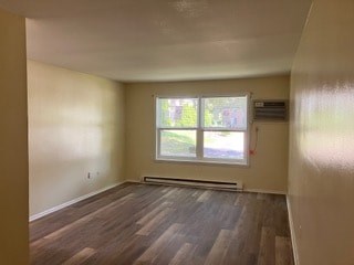 A room with a window and a radiator on the wall.
