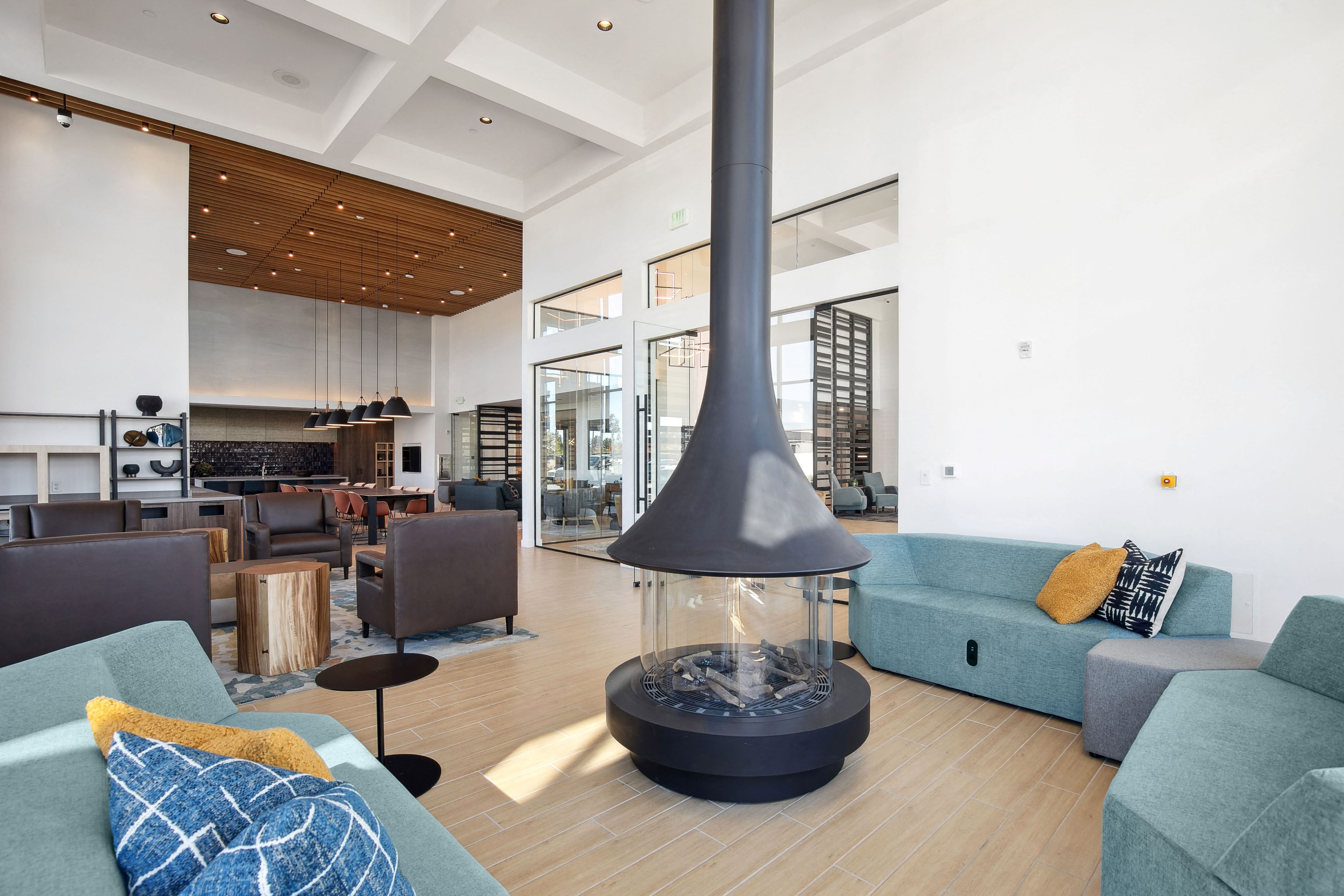 a living room with couches and chairs and a fireplace