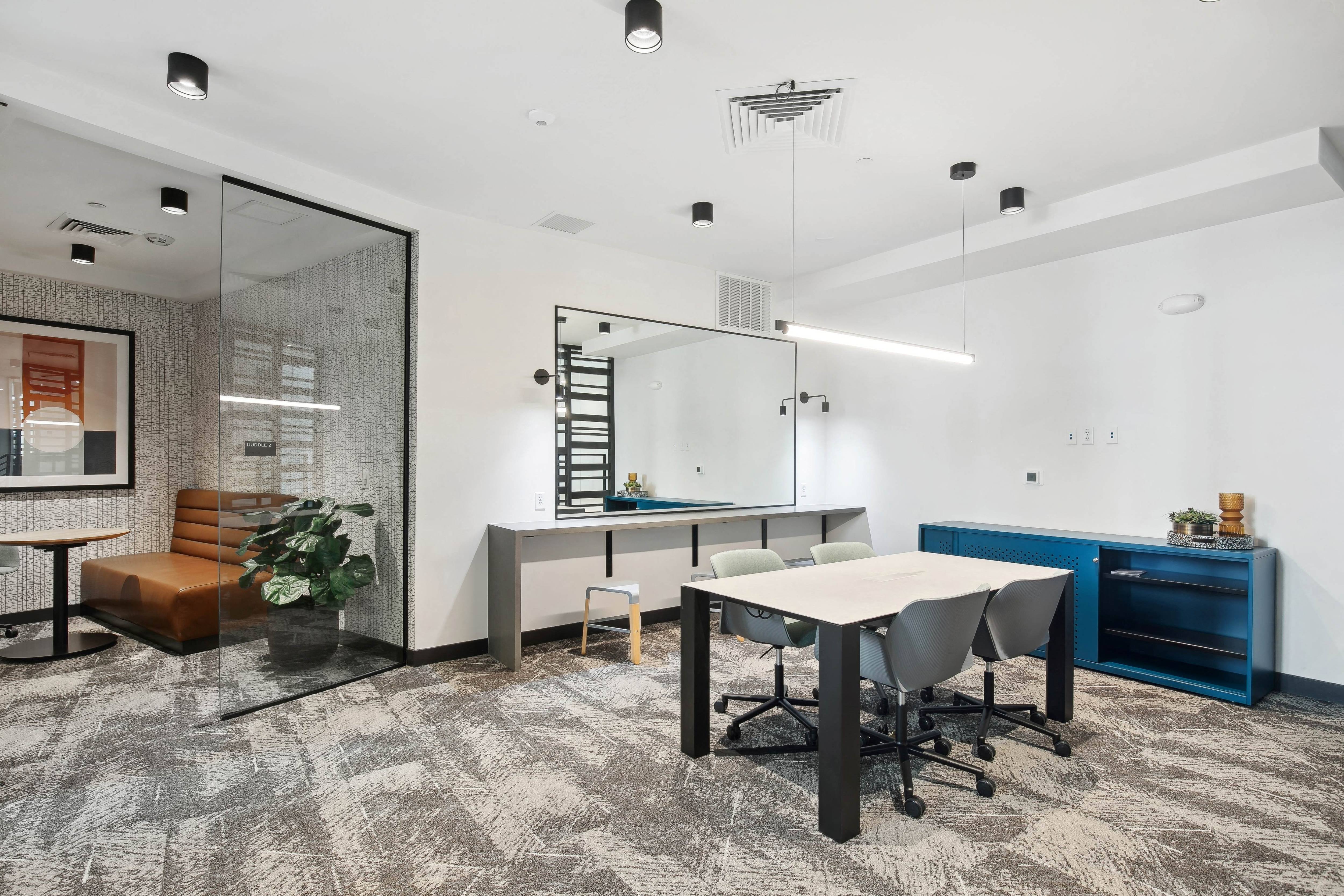 a dining room with a table and chairs
