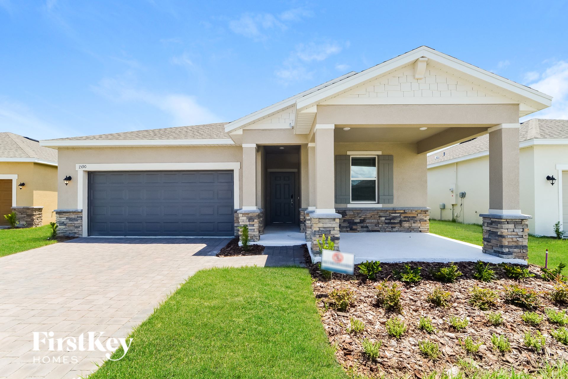 a house with a driveway and a garage door