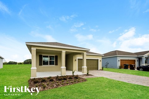a house with a lawn and a driveway