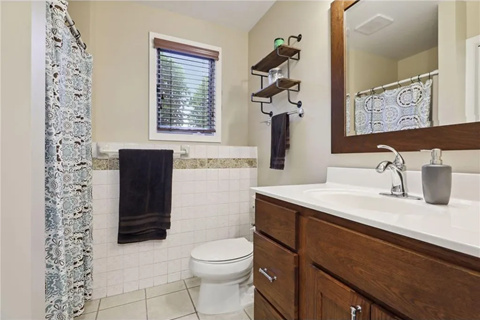 a bathroom with a sink toilet and a shower