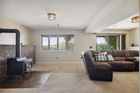 a living room with a couch and a fireplace