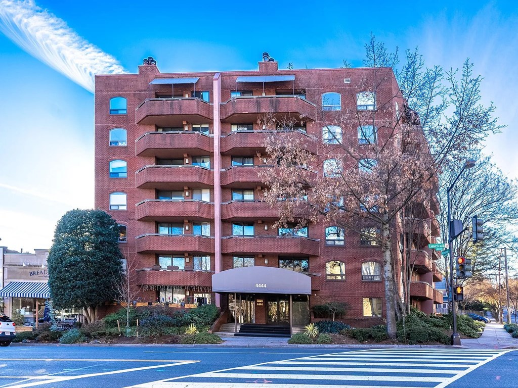 a large brick apartment building on a city street