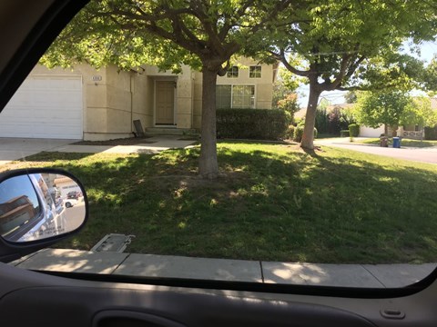 a view of a house from the inside of a car