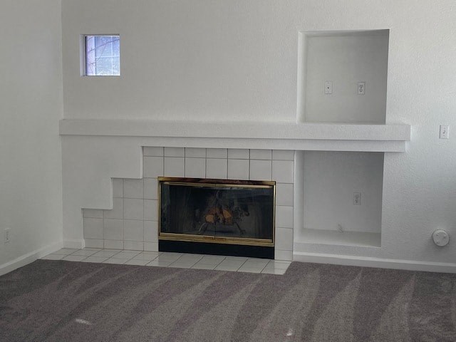 a living room with a fireplace and a window