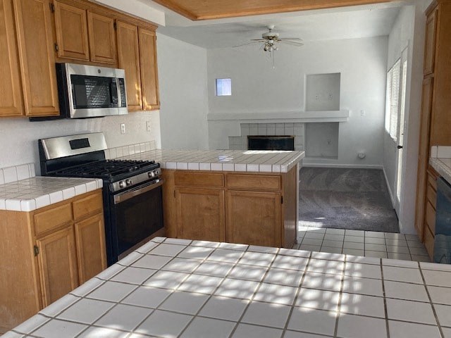 an empty kitchen with a stove and a microwave